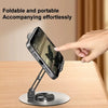 A hand is easily placing a smartphone onto a foldable and portable desktop stand for viewing.