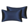A set of two dark navy blue silky satin pillowcases.