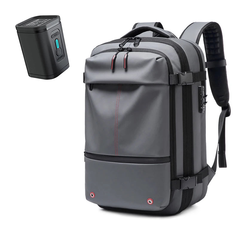 A gray expandable travel laptop backpack with a separate vacuum compression unit.
