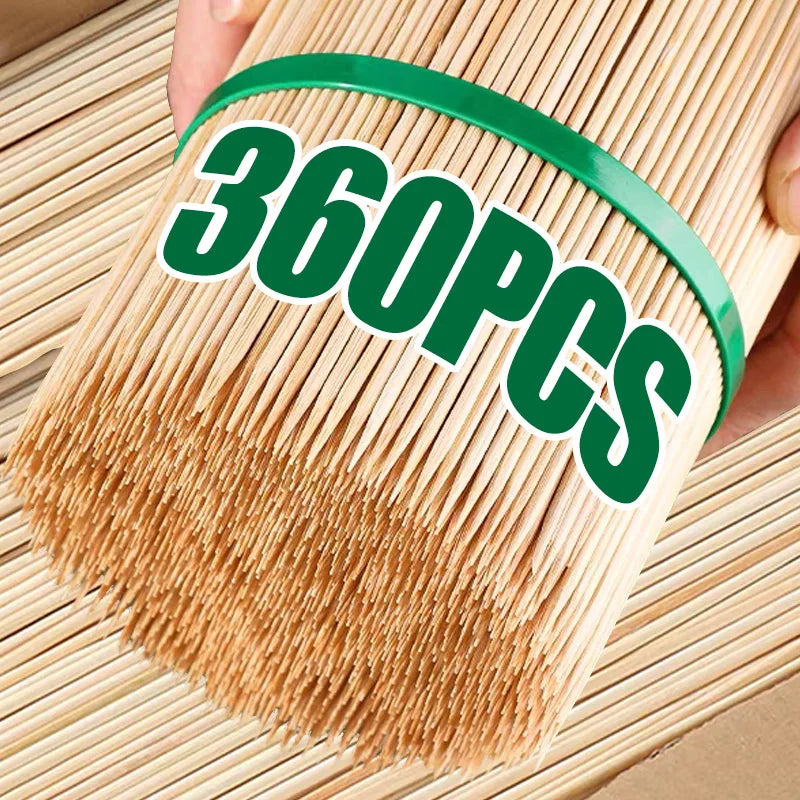A hand holds a bundle of natural bamboo skewers with a green band, showing 360 pieces.