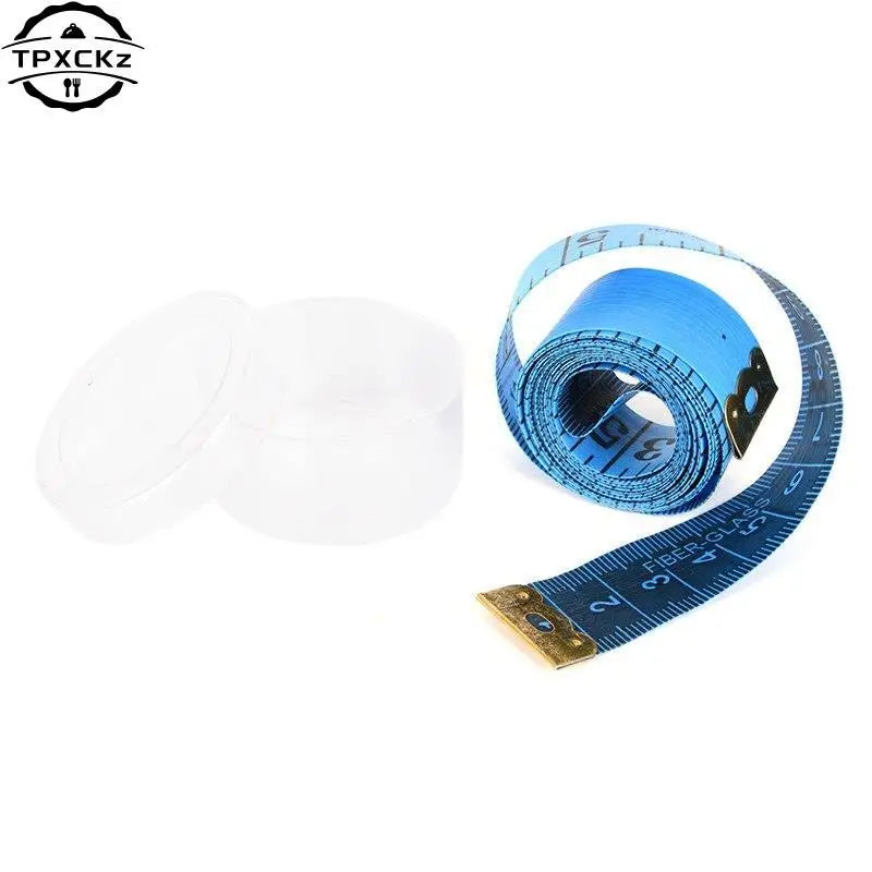 A roll of blue flexible tape measure with markings and a clear plastic container for sewing and body measurements.