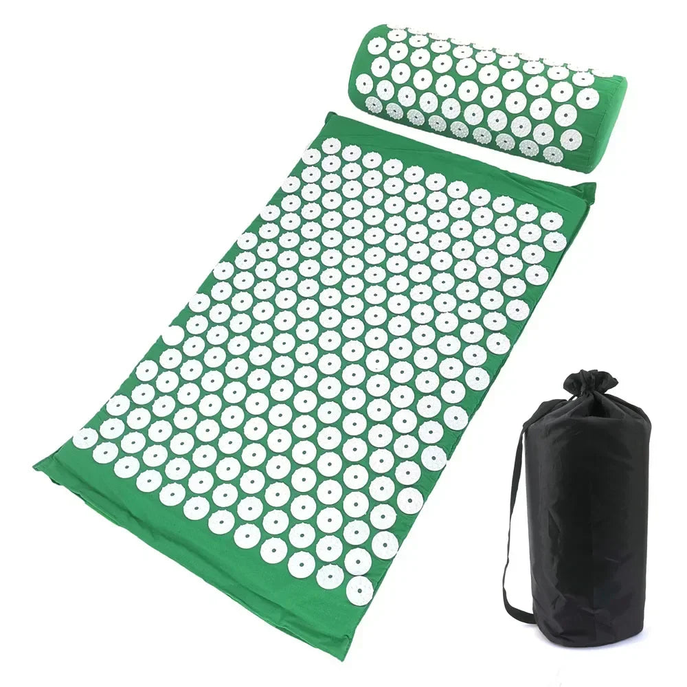 A green acupressure mat and pillow set with white dots for pain relief and relaxation.