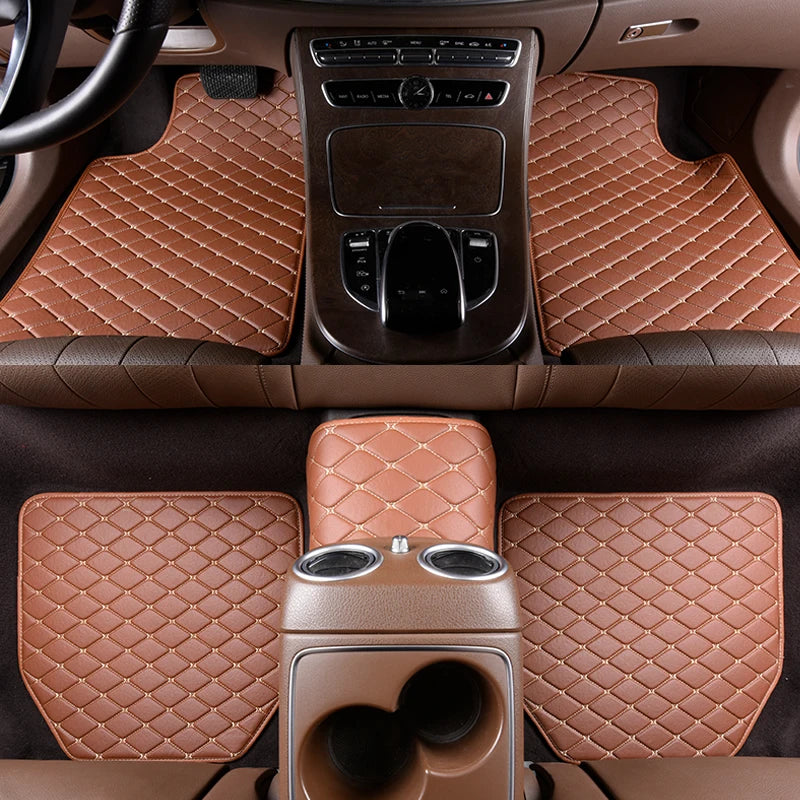 Interior view of a car with five waterproof leather floor mats installed on the floor.