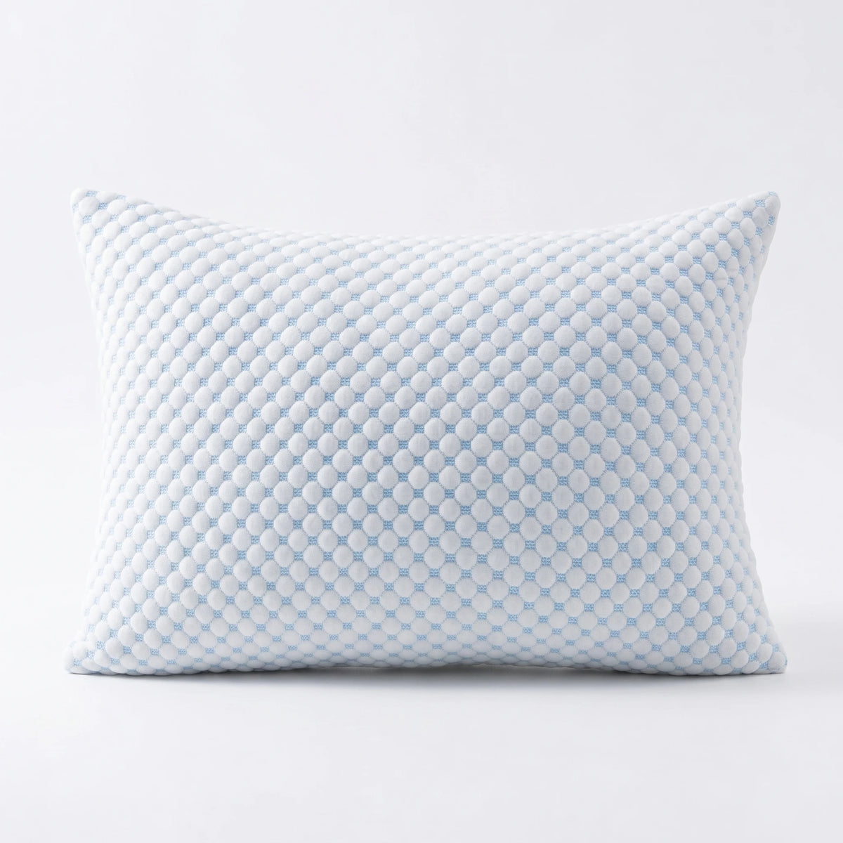 A light blue textured memory foam pillow with a quilted pattern.