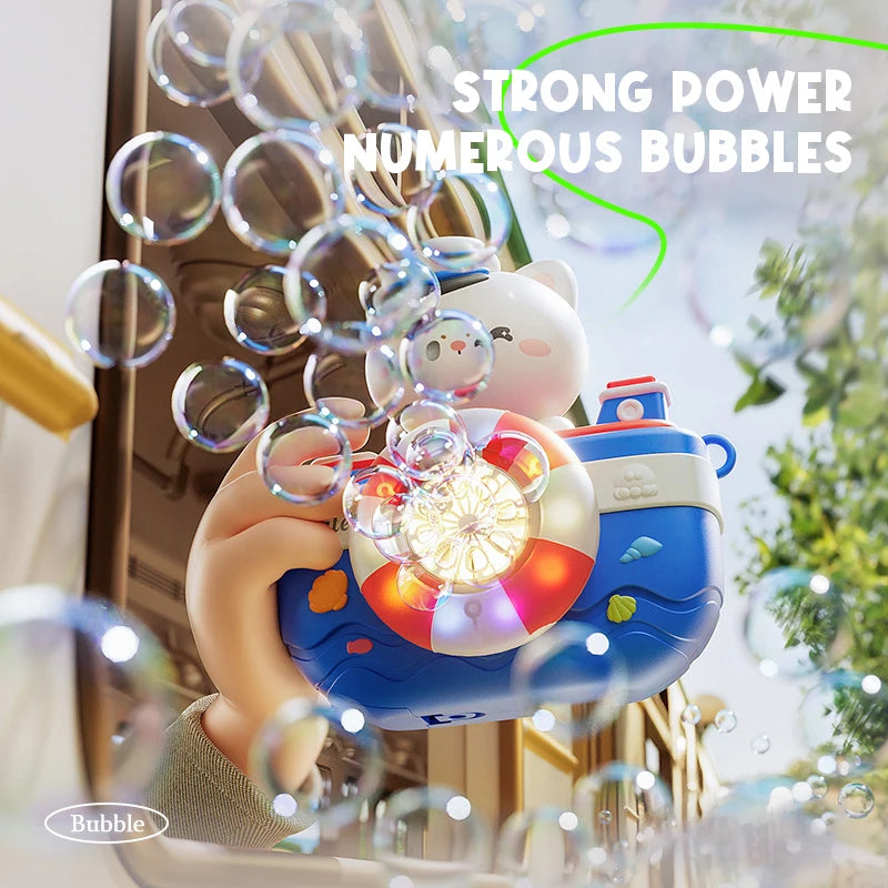 A hand holds a camera-shaped automatic bubble machine with lights and music, surrounded by numerous bubbles.