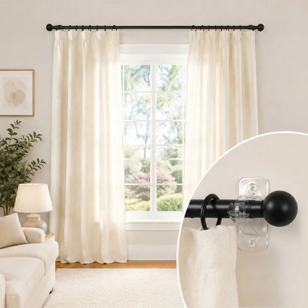 Cream sheer curtains hanging from a black curtain rod with adhesive and screw mounting brackets