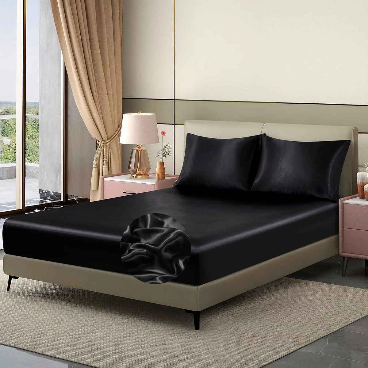 A luxury satin fitted sheet is displayed on a bed with neutral bedding and elegant drapery.