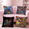 A set of cushions featuring printed designs of Monster Hunter Rathalos and Nargacuga dragons on a pink sofa.