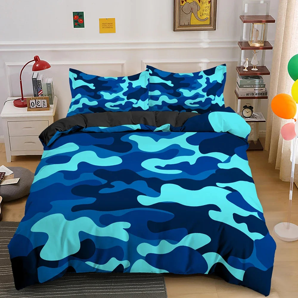 A blue and teal camouflage duvet cover set displayed on a bed with white nightstands and wooden shelving.