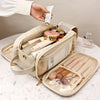 A beige cosmetic bag is shown open, revealing various makeup and grooming tools, with a hand holding a cosmetic product above