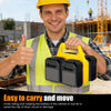 A smiling man wearing a safety vest holds a yellow portable battery storage organizer for power tool batteries.