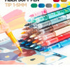 A collection of 12 fiber soft pen markers in various colors and shades laid out next to a hand using one of the pens on patte