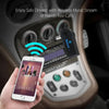 A hand holds an iPhone near a car stereo featuring a Bluetooth audio receiver and AUX adapter for wireless music or hands-fre