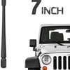 A close-up view of a 7 inch universal car radio antenna installed on a white vehicle.