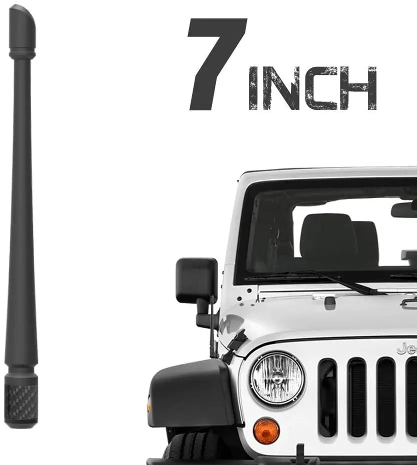 A close-up view of a 7 inch universal car radio antenna installed on a white vehicle.