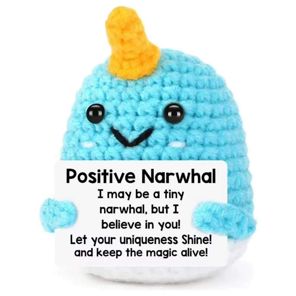 Handmade crochet blue narwhal plush toy with a positive message card