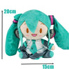 A soft teal Hatsune Miku plush doll figure with large ears and a smiling face.