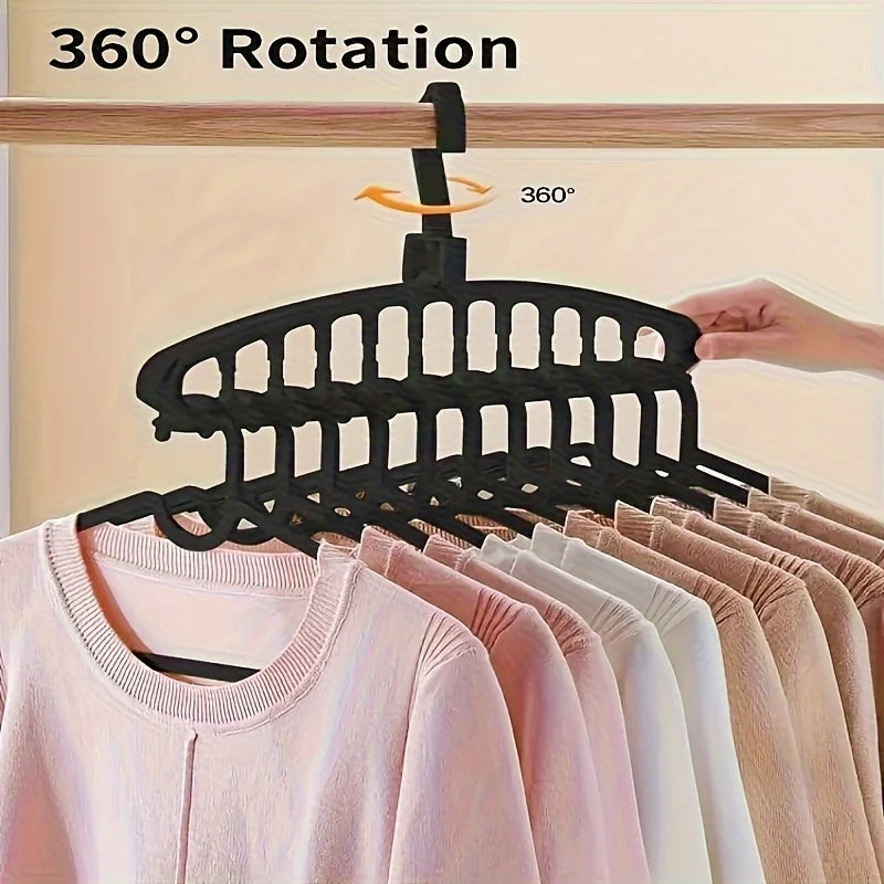 Black multi-layer space-saving closet organizer hangers demonstrating 360 degree rotation.