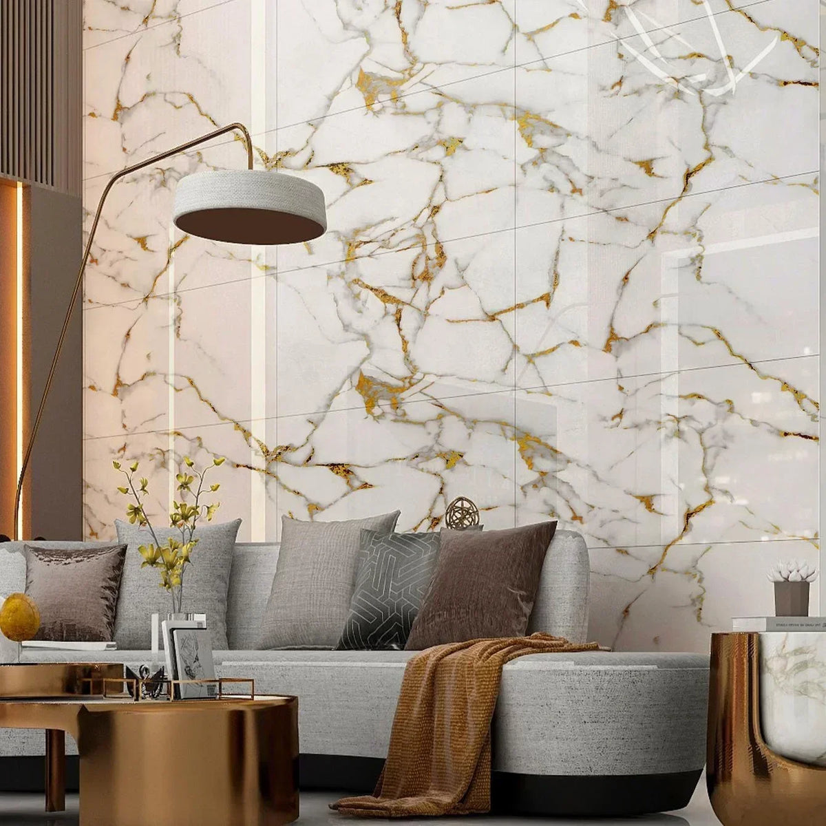 A modern living room featuring a sofa and a light fixture against a marble-patterned wall.