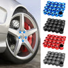 A collection of blue, black, and red anti-rust wheel nut caps displayed next to a car wheel.