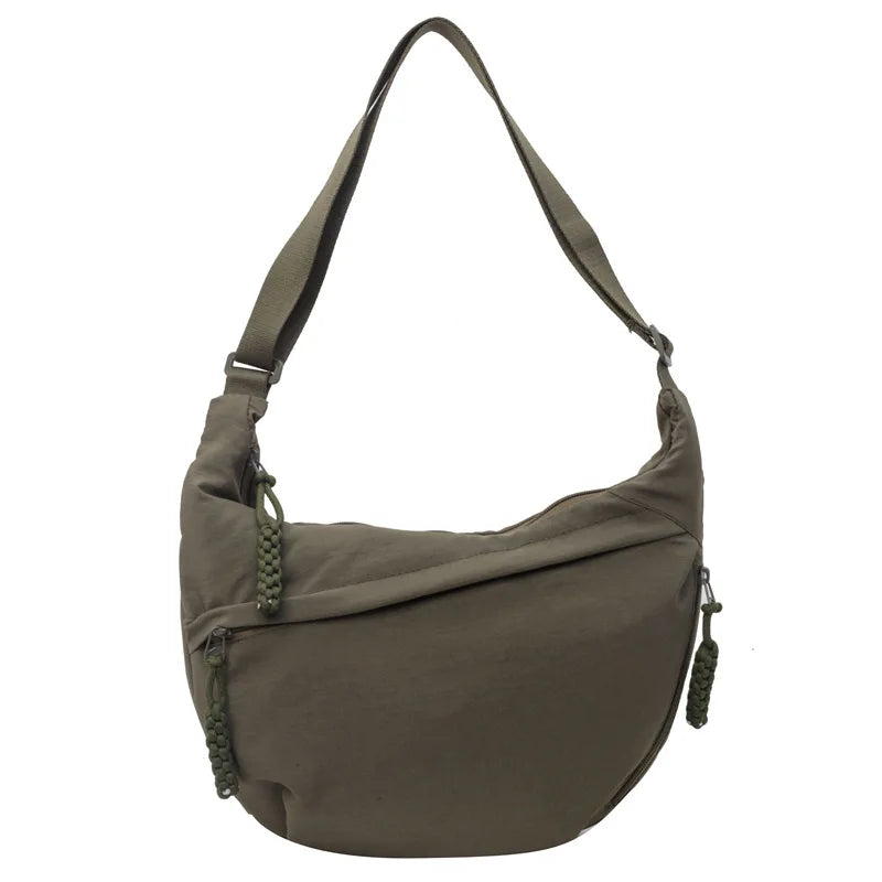 A khaki green lightweight nylon crossbody bag with an adjustable strap.