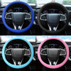 Four images showing a steering wheel covered in silicone grips of blue, black, cyan, and pink colors.