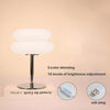 Modern cloud-shaped bedside lamp with a silver base and adjustable light, featuring 3-color dimming and 10 brightness levels.