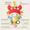 A red and orange stuffed crab sensory toy with a clip, teether, and sound beads for babies.