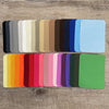 A collection of iron-on fabric patches in various shades of gray, beige, brown, blue, and teal.