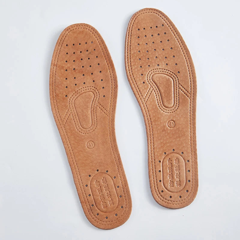 Pair of tan genuine leather insoles for men with perforated soles and contoured footbeds