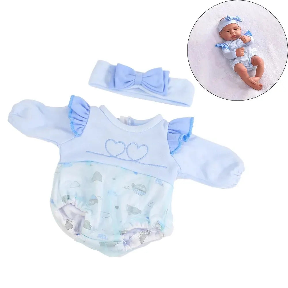 A light blue baby outfit set for a doll including a top, bottom, and bow accessory.