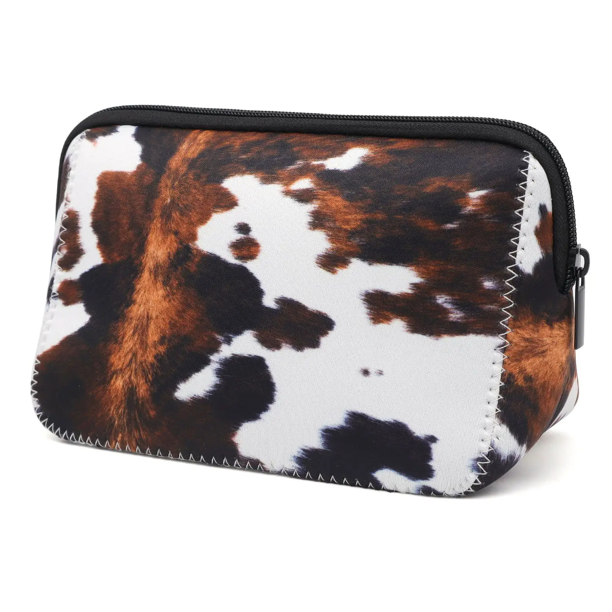 A black and white cow print waterproof neoprene cosmetic bag with a zipper.