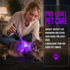A woman uses a mini UV flashlight to examine the skin of a cat for potential health issues.
