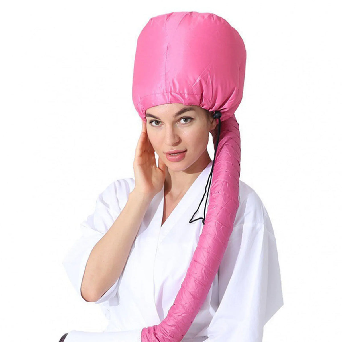 A woman wearing a bright pink reusable hair drying and conditioning cap.