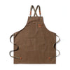 A brown canvas apron with straps and large front pockets.
