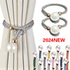 Set of two silver and gold pearl rope curtain tie-backs displayed against a light fabric backdrop.