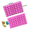 A pink silicone mold with small heart-shaped cavities for DIY candles, soap, and chocolate.