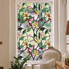 Floral stained glass window film featuring pink, yellow, and green leaves on a dark background.