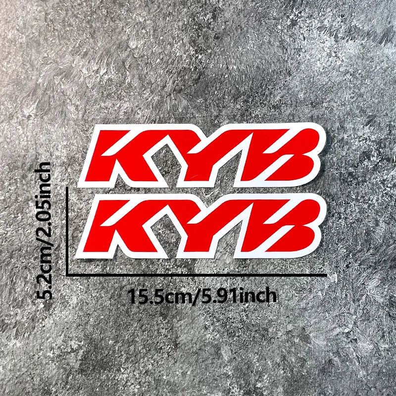 Two stacked red and white KYB motocross motorcycle fork stickers on a gray textured background.