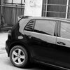 Black VW Golf side rear window louvers covered on a vehicle.