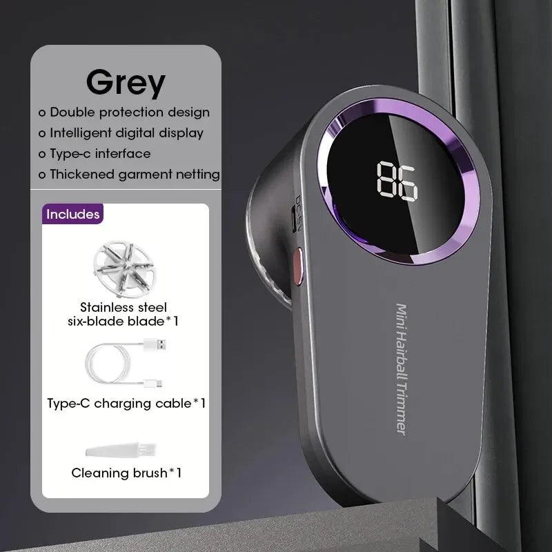 A grey Mini Hairball Trimmer electric lint remover with a digital display and accessories shown on a dark surface.