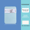 A light blue tin box containing 24 sheets of 100% cotton watercolor paper for postcards.