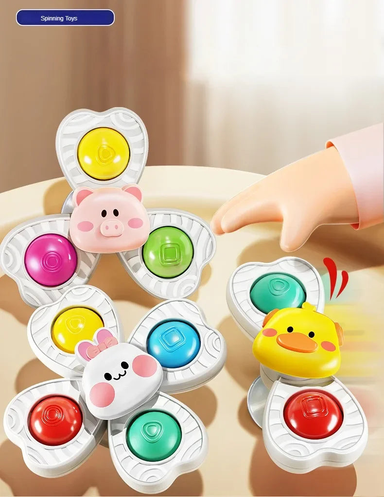 A set of colorful spinning bath toys for toddlers including plastic animals like a pig, duck, and other shapes.