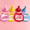 A set of four colorful birthday party hats and bibs for pets, featuring numbers 1 through 4 in pink, yellow, red, and blue.