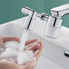 A hand is holding a clear faucet extender, which is dispensing a stream of water into the palm of the hand.