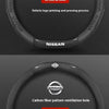 A black carbon fiber steering wheel cover with a pattern and ventilation holes for an anti-slip grip.