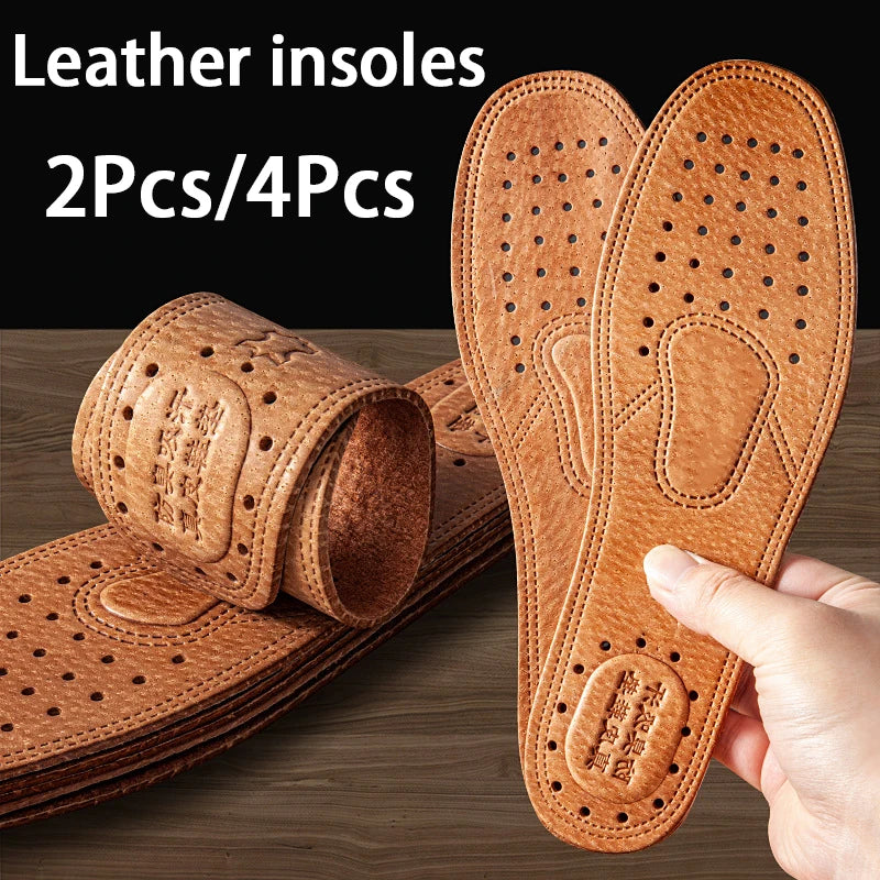 A hand holds a pair of genuine leather insoles, showing the textured sole design and thickness.