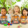 A girl holds an orange and blue cartoon backpack goodie bag for kids party favors in a bright outdoor setting.