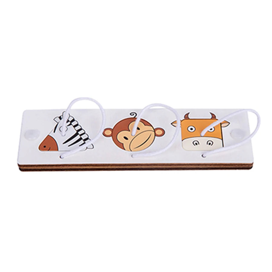 A wooden Montessori busy board featuring carved or printed figures of an elephant, monkey, and cow with white laces.