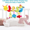 Colorful plush spiral activity toys hanging from a crib, designed for baby's entertainment.